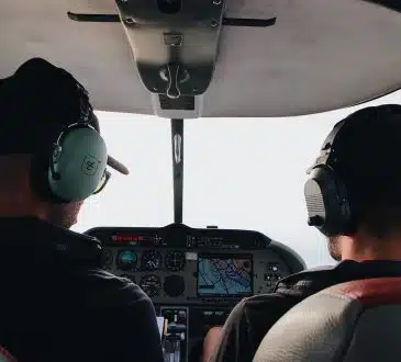 two pilots manuevering the plane