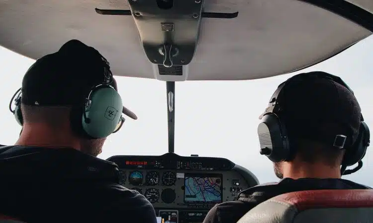 two pilots manuevering the plane