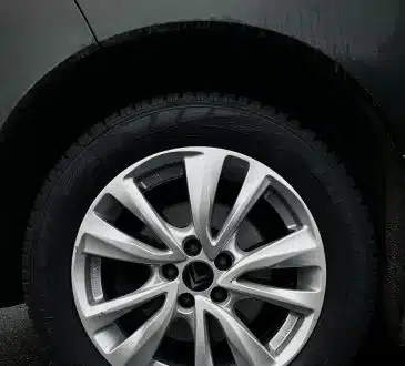 silver 5 spoke wheel with tire