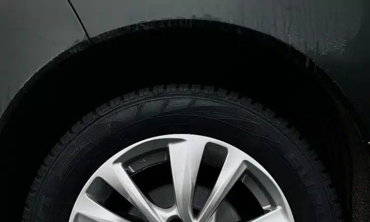 silver 5 spoke wheel with tire