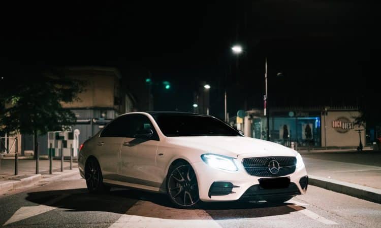 white mercedes benz coupe on road during night time